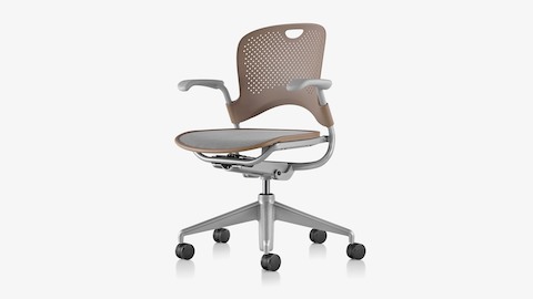 A light brown Caper Multipurpose Chair with a grey seat, viewed from an angle and showing contoured seat and back.