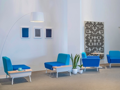An interaction area featuring various Sabha Collaborative Seating elements in shades of blue.