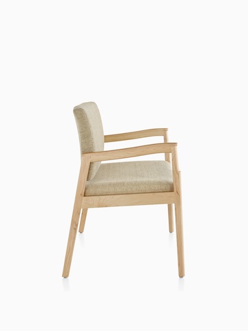 Profile view of a beige Monarch Plus chair with a wide seat. Select to go to the Monarch Plus Seating product page.