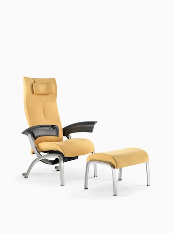A mustard-coloured Nala Patient Chair and ottoman.