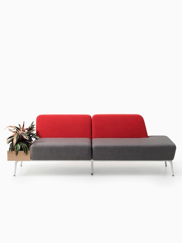 A two-seat Sabha Collaborative sofa with a red back, grey seat, and built-in planter.