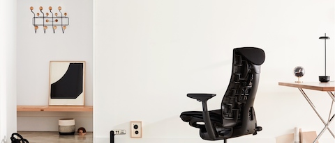 A black Embody office chair, viewed from the back at an angle.